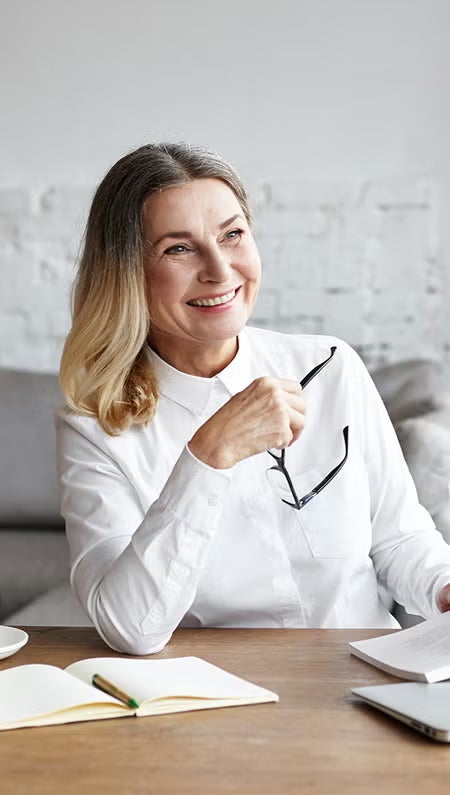 Juris Doctor student with a book, smiling