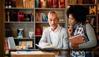 Two professionals engage in active learning strategies for career and professional development