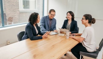 A lawyer reviews legal documents related to practising law in Australia.