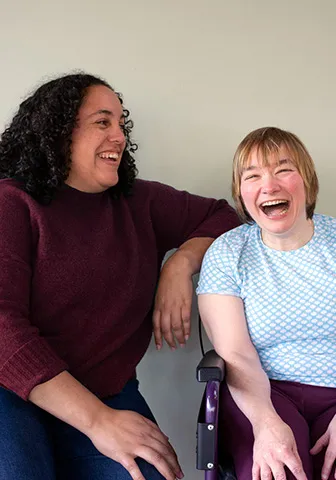 Carer laughing with client