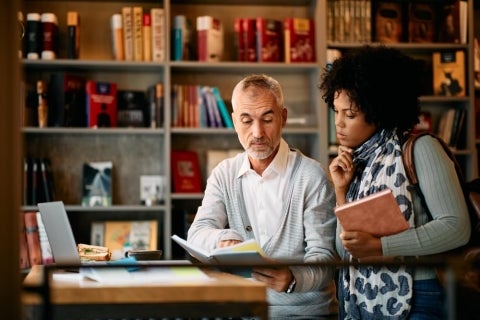 Two adult learners practicing active learning.