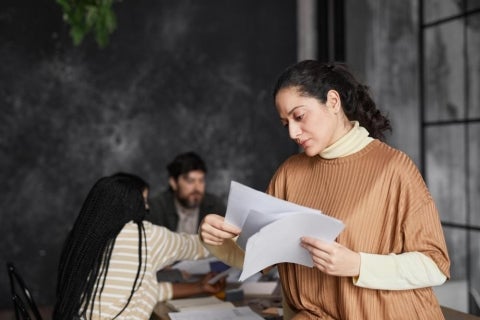 A social worker goes through important documents