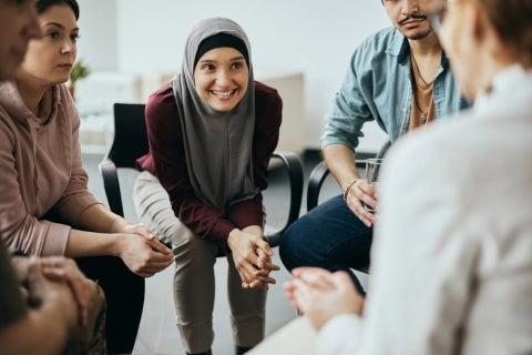 A case manager working and discussing with a group of people.